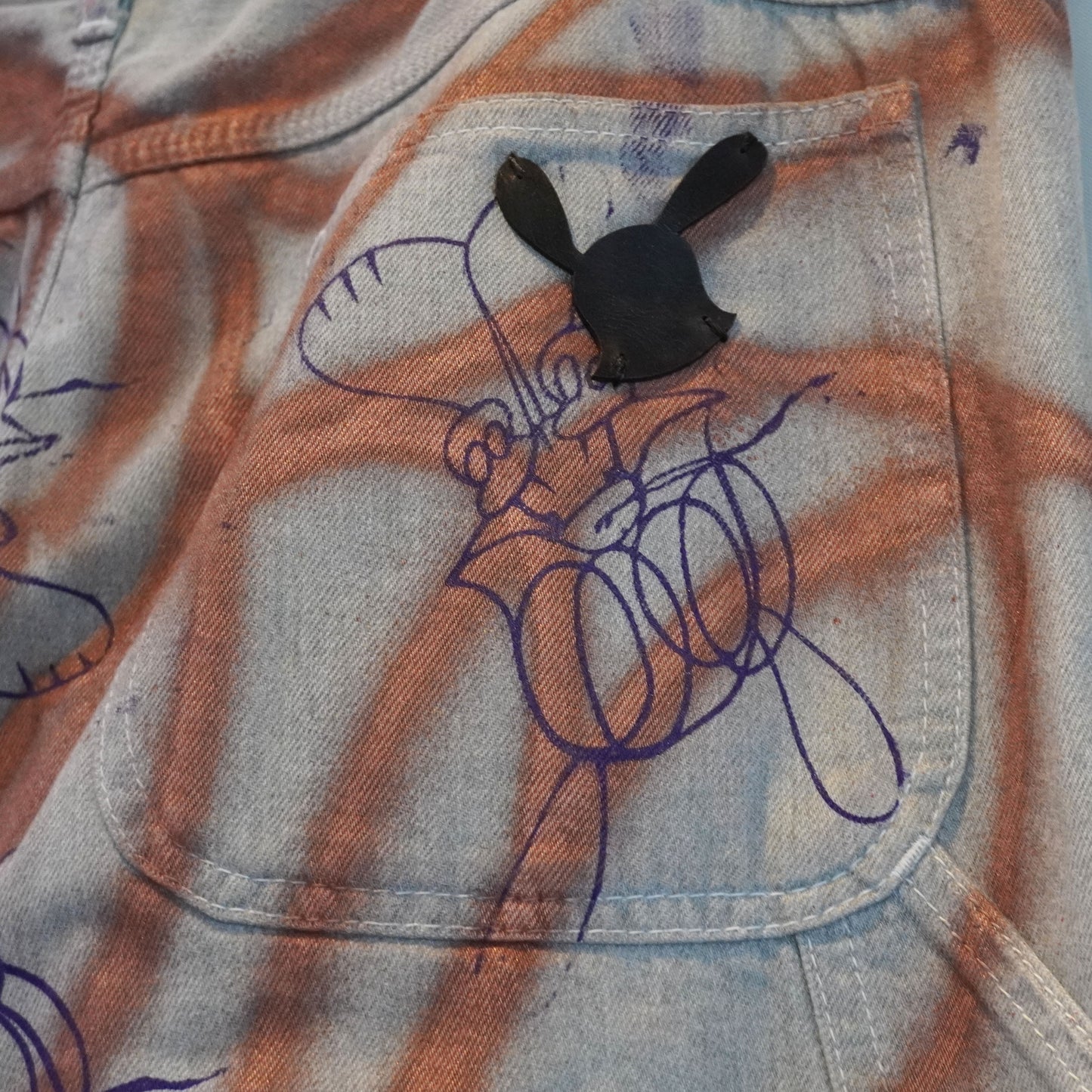 SKOLOCT SPRAY PAINTED JEANS - 36