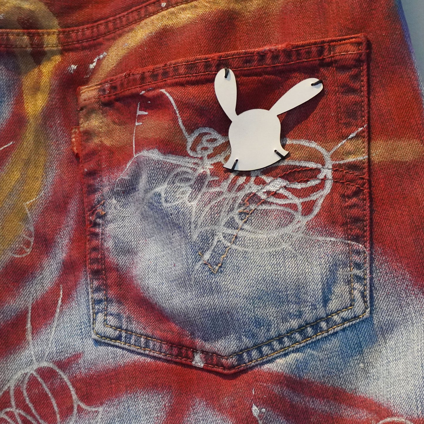 SKOLOCT SPRAY PAINTED DENIM PANTS - 36